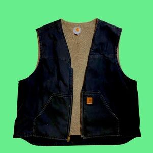 Black Carhartt vest with tan wool lining.